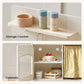 Storage counter with a wooden bowl and salt and pepper shakers, followed by open cabinets with food items.