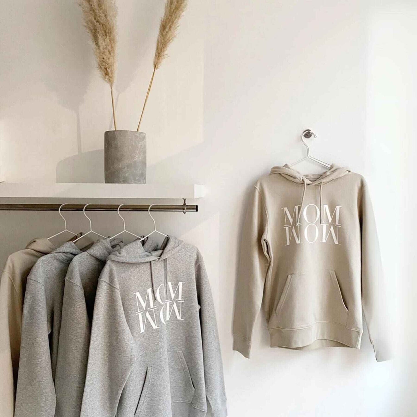 Unique Love Design Hoodie ‘MOM WOW’ Hanging on the Wall