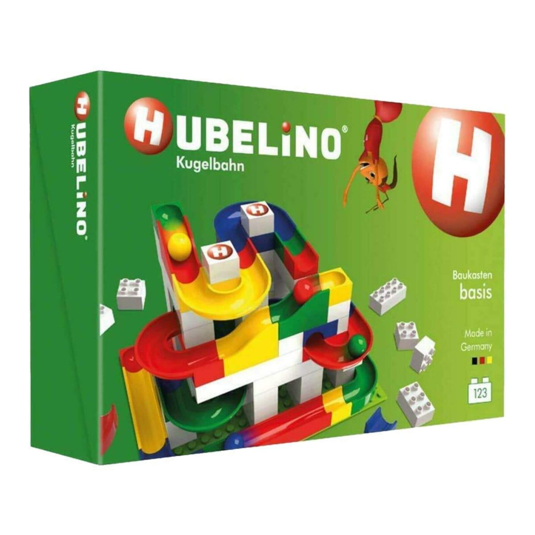 Hubelino toy set packaging with colorful building blocks on a green background