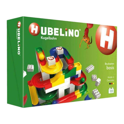 Hubelino toy set packaging with colorful building blocks on a green background