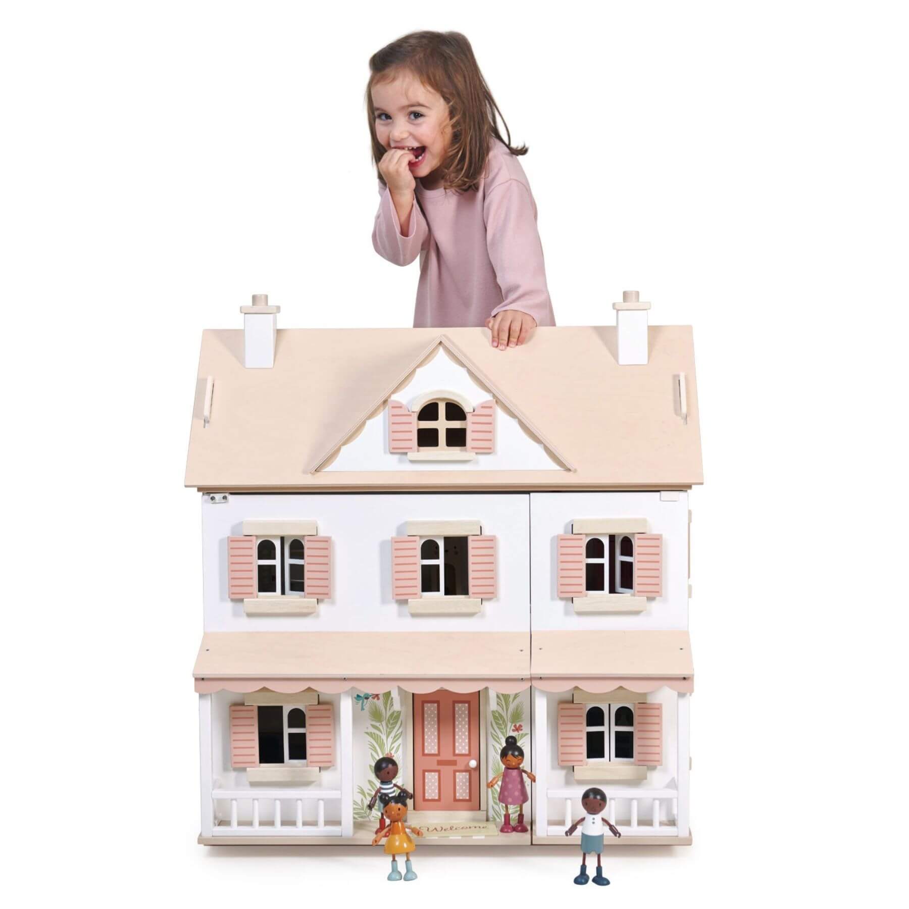 Child playing with Tender Leaf Humming Bird House with miniature figures on a white background