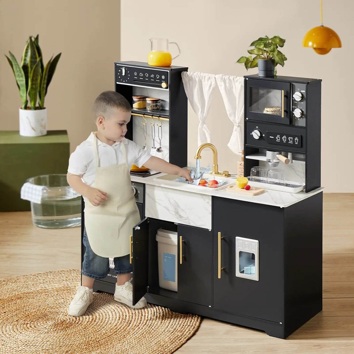 Boy Playing Tiny Land® Iconic Aqua Kitchen with Real-Flow Water System - Black