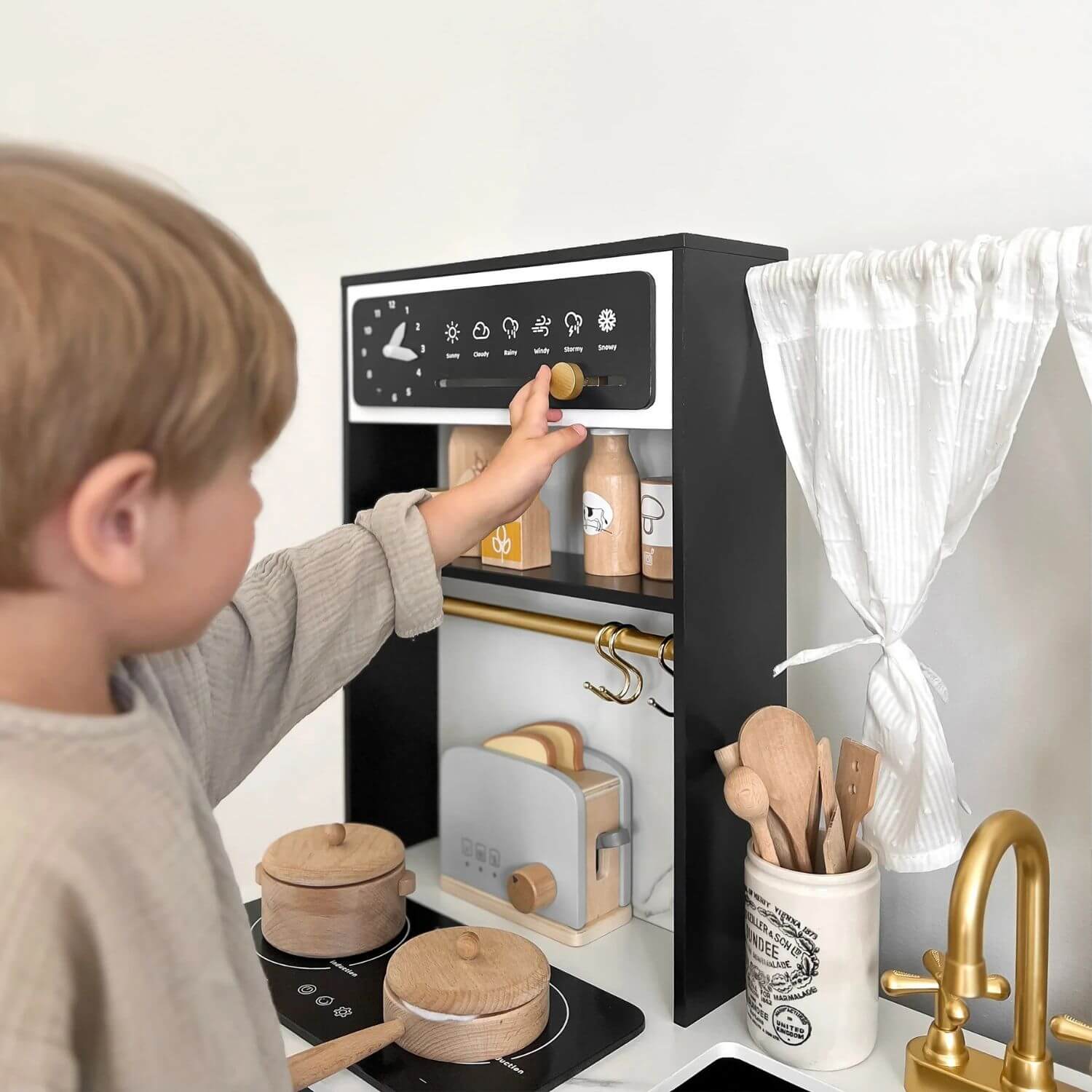 Boy Playing Tiny Land® Iconic Kitchen - Black