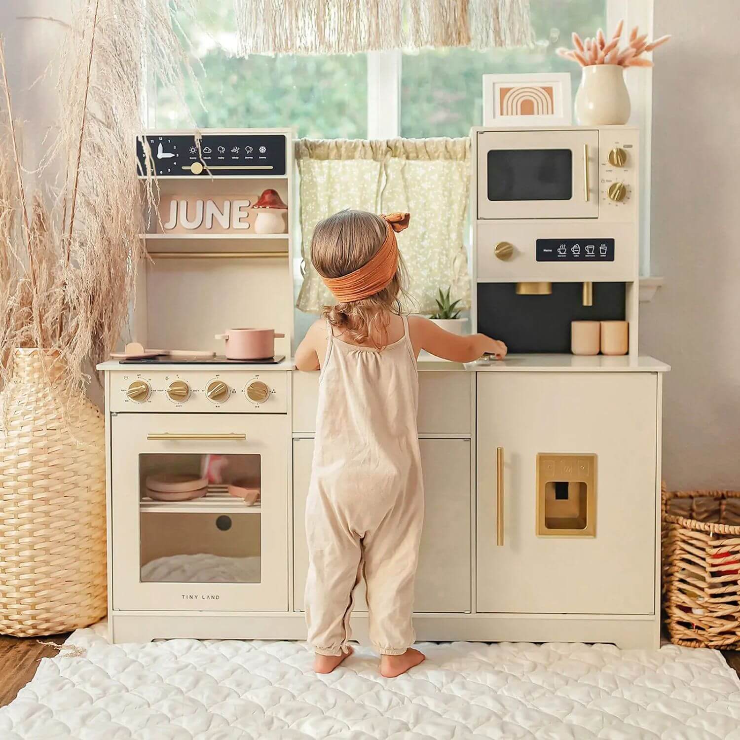 Girl Playing Tiny Land® Iconic Play Kitchen - Cream