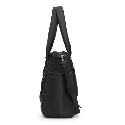 Luli Bebé Infinite Diaper Bag - Black, shown from a side profile view against a plain white background.