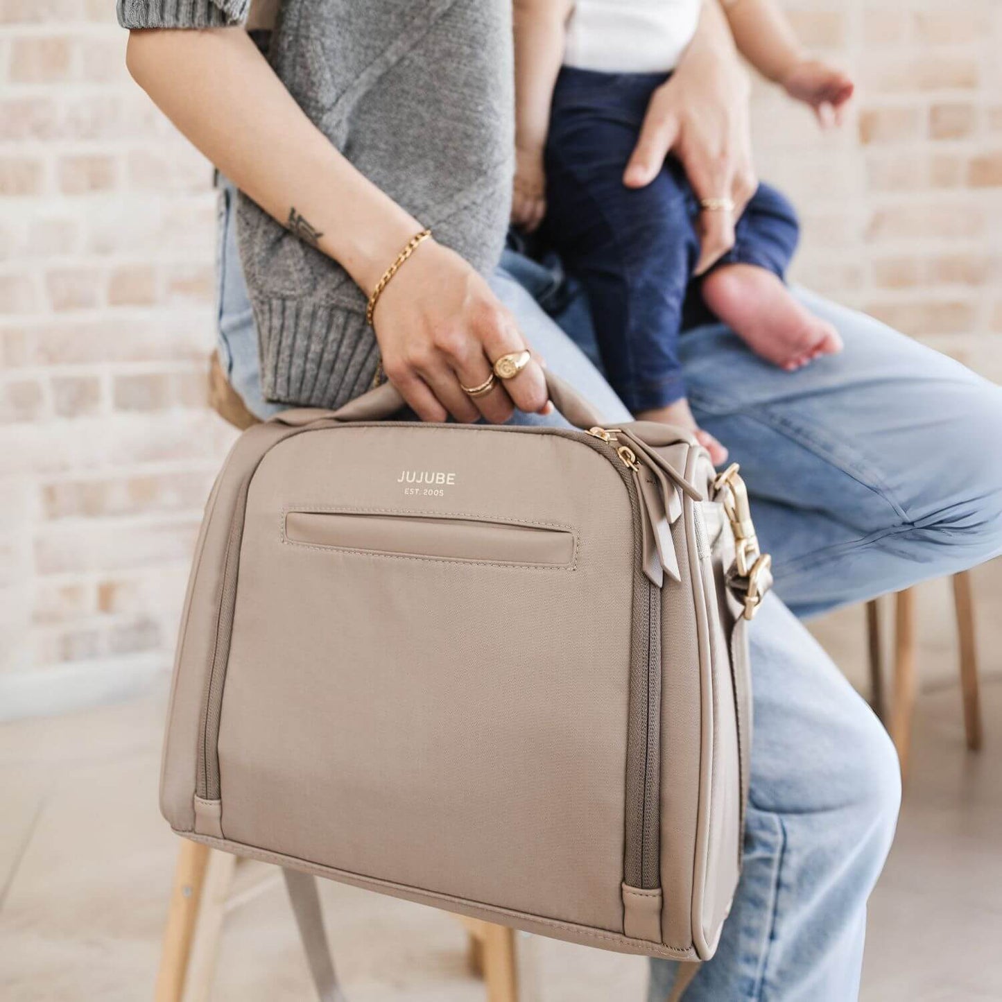 Woman Hand Carrying JuJuBe Insulated Bottle Bag Taupe