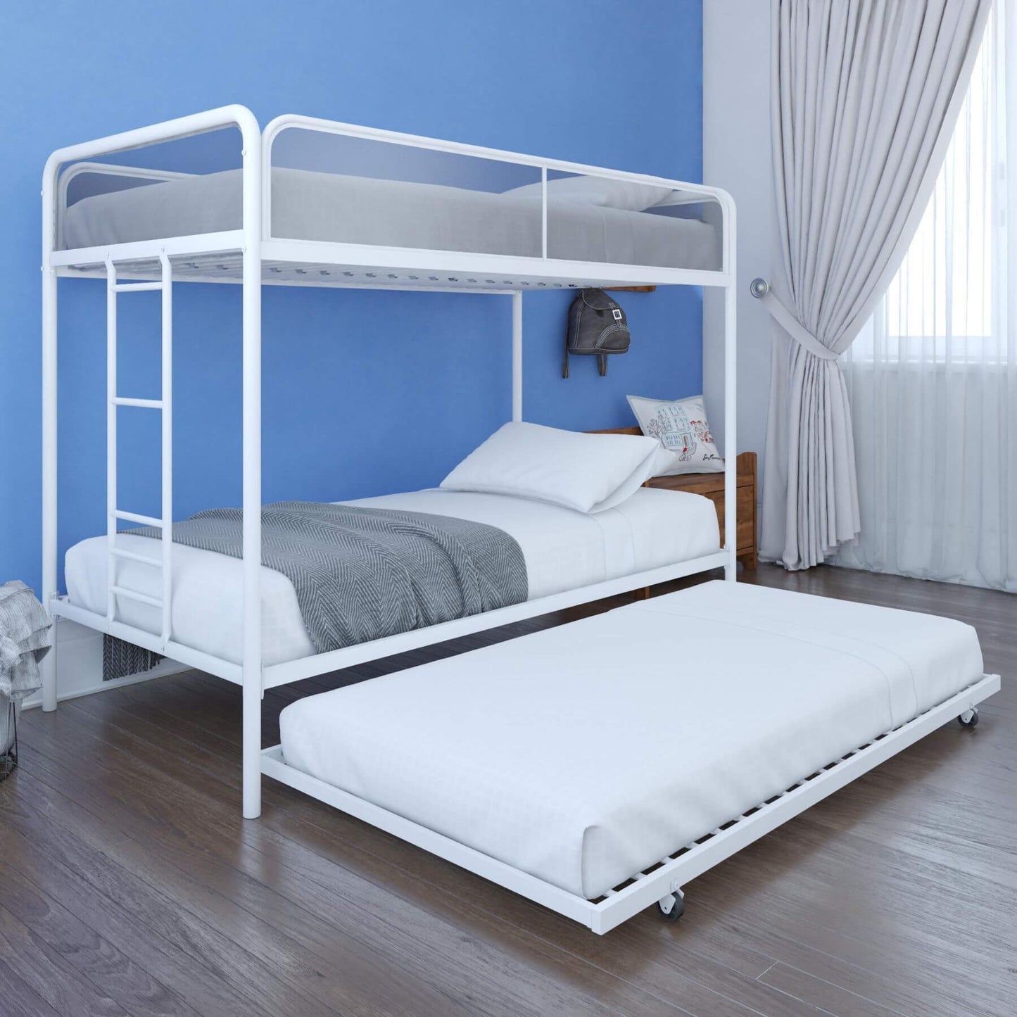 DHP Isaiah Triple Twin Metal Bunk Bed in a room with blue walls and curtains.