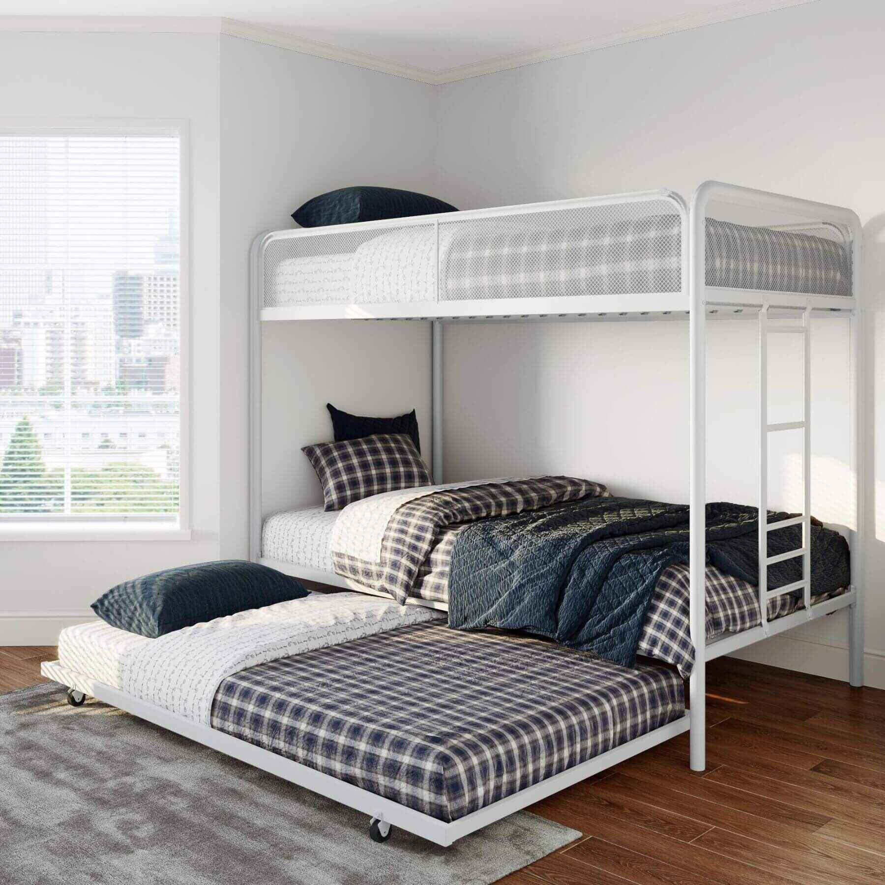 DHP Isaiah Triple Twin Metal Bunk Bed with plaid bedding in a room with a window and rug.