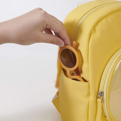 Yellow backpack with a pocket on a white background