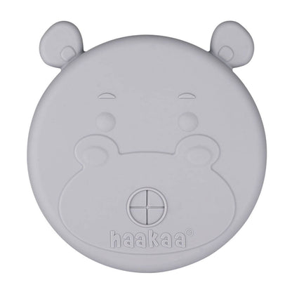 Gray hippo-shaped lid with 'haakaa' branding on a white background