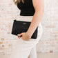 Woman Holding JuJuBe Pouch Clutch Purse Black