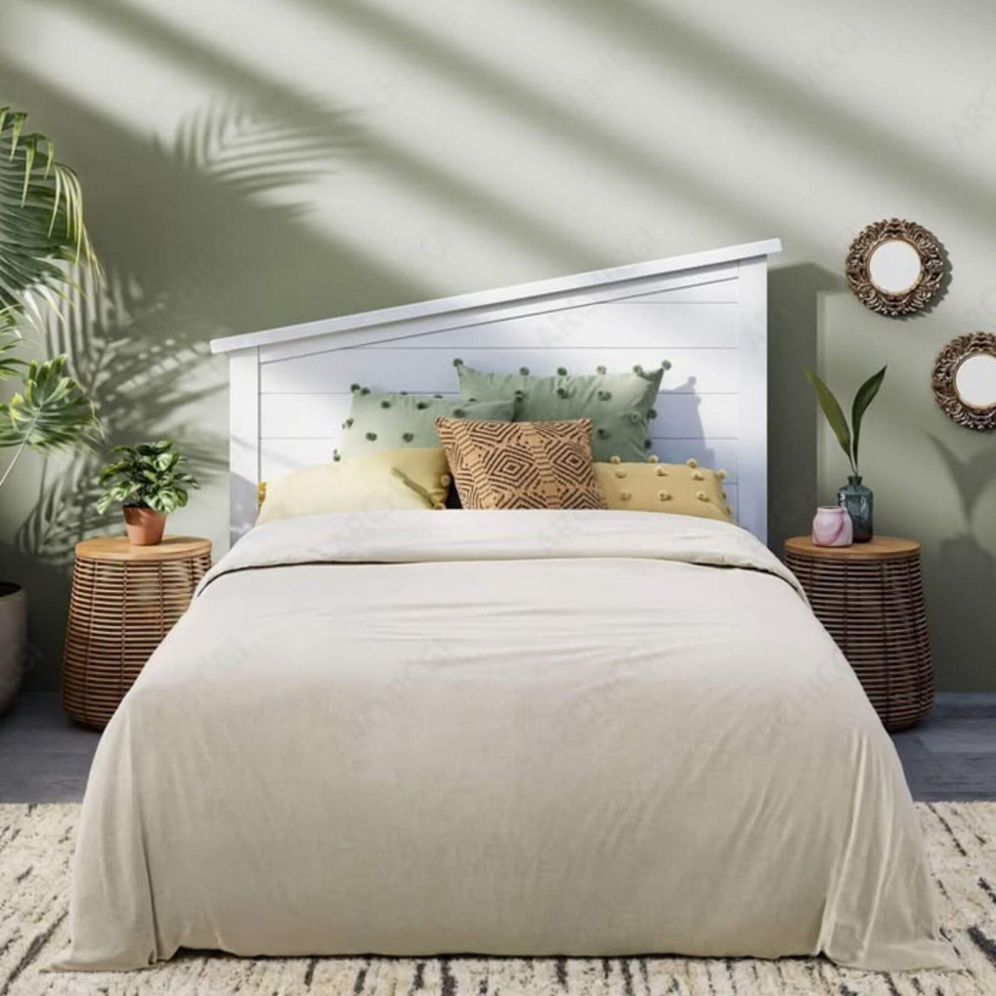 Bedroom with a bed, pillows, and decorative elements in a home setting.