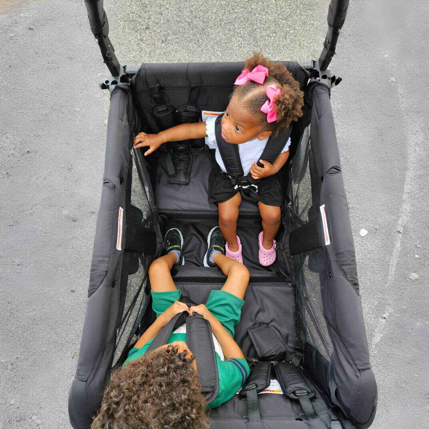 Kids Sitting in Keenz DUO Stroller Wagon