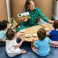 Teacher and Kids Sitting at RAD Children's Furniture Kidney Table