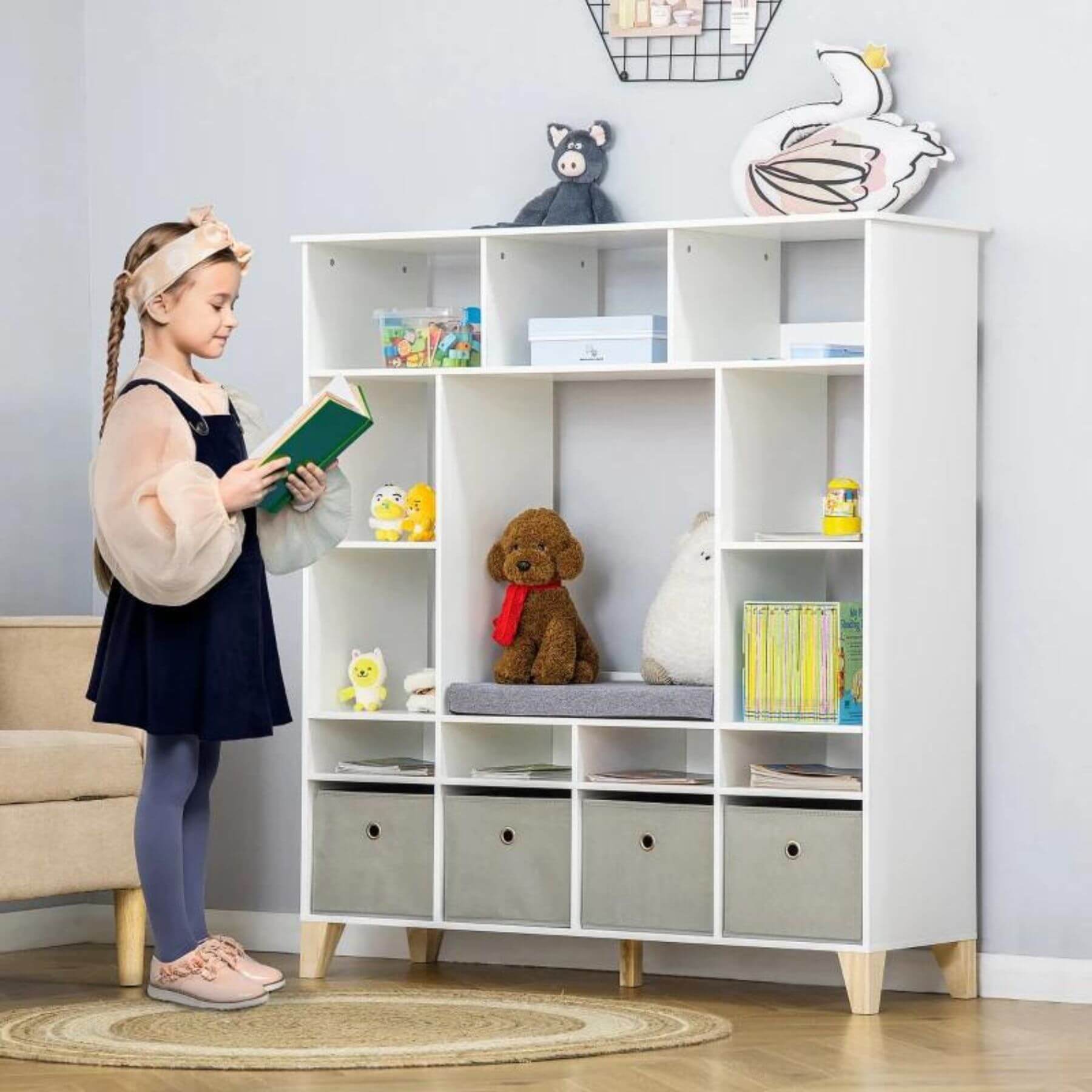 Girl Reading next to HOMCOM Wooden Kids Cabinet Organizer White