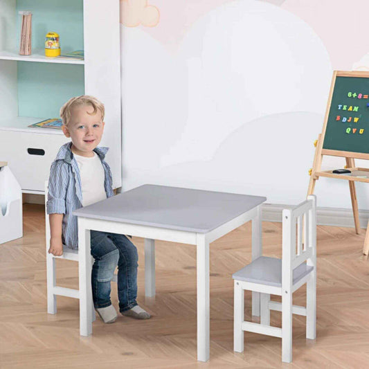 Boy Sitting at Qaba Kids Table and 2 Chairs Set Toddler Multi-usage Desk Grey