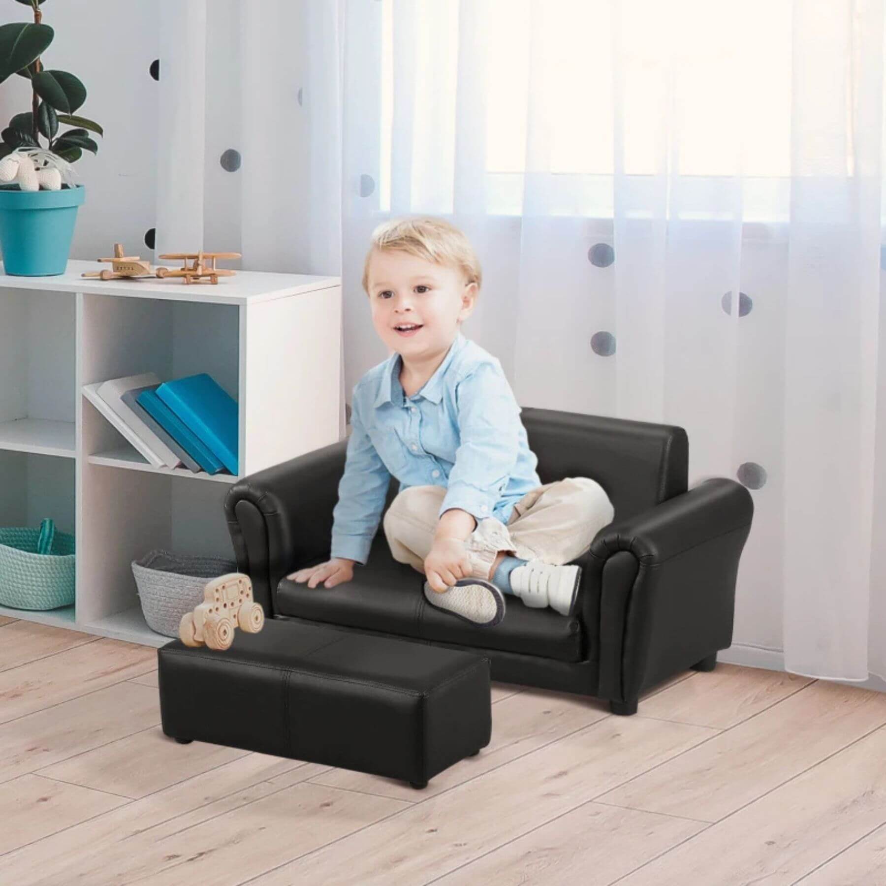 Boy Sitting on Qaba Kids Sofa Set with Footstool for Toddlers and Babies, Black