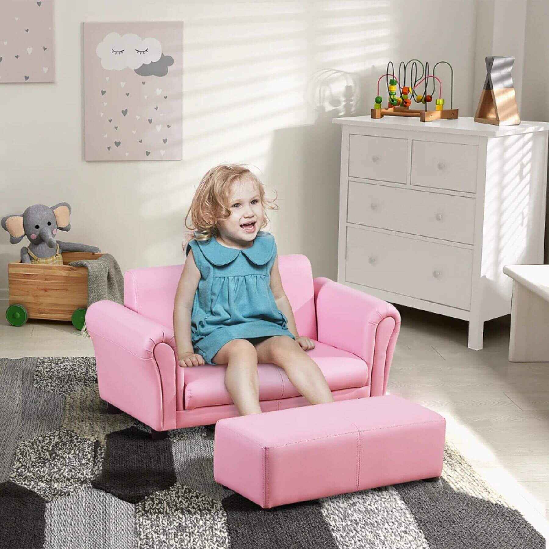 Girl Sitting on Qaba Kids Sofa Set with Footstool for Toddlers and Babies, Pink