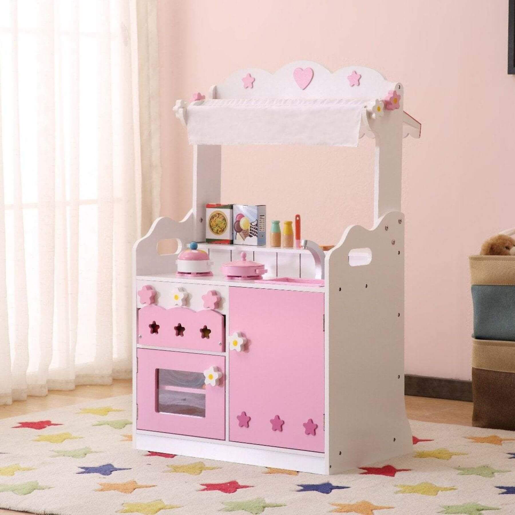 Kids Funnel 2 In 1 Pink Pretend Kitchen and Market Stall with pink and white design in a room.