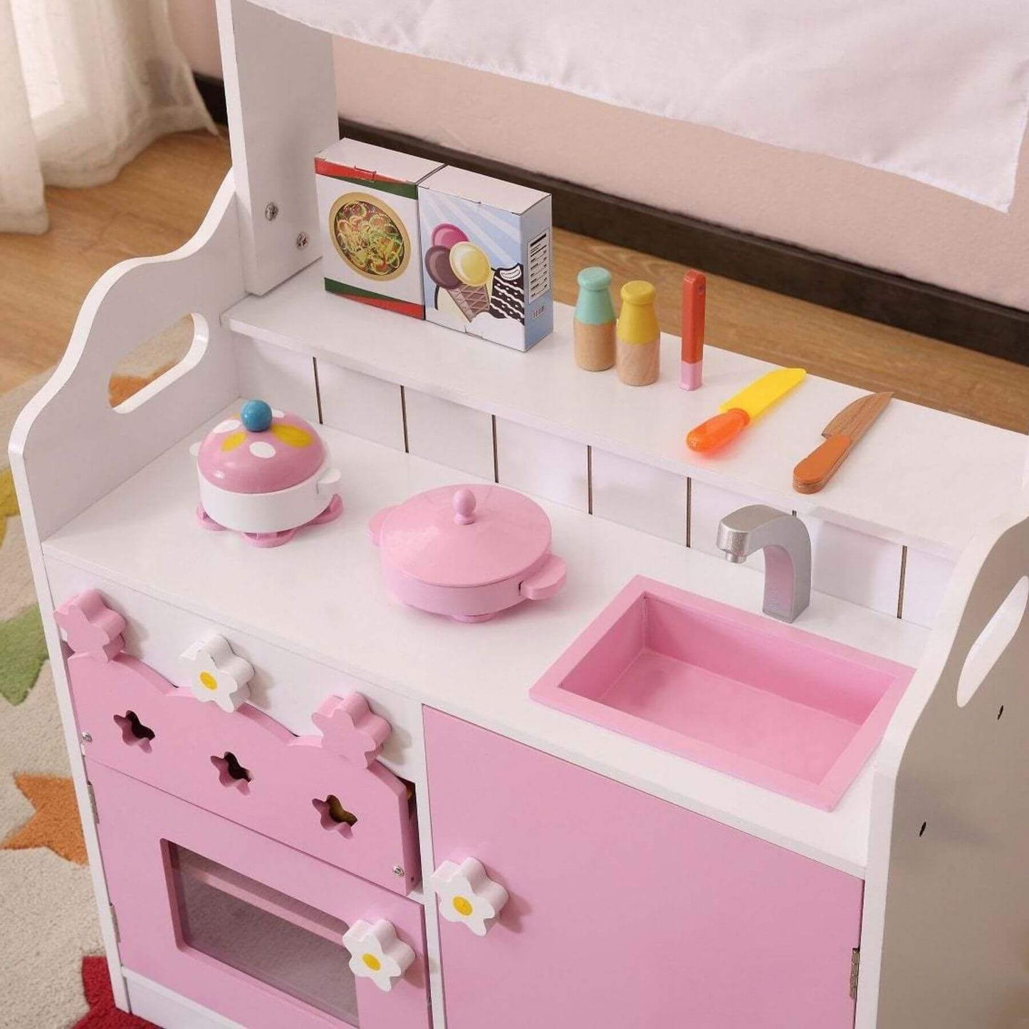 Kids Funnel 2 In 1 Pink Pretend Kitchen and Market Stall with accessories on a wooden floor.