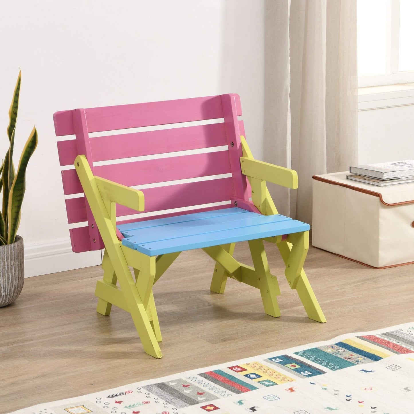 Colorful bench with pink backrest and blue seat in a room setting.
