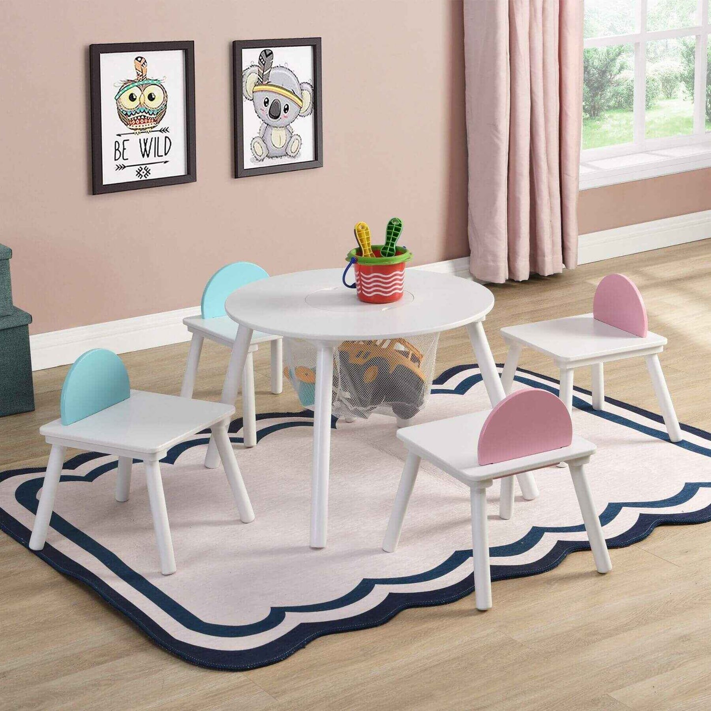 Children's playroom with Civil HN Children's White Panel Table with 4 Chairs Set on a decorative rug.