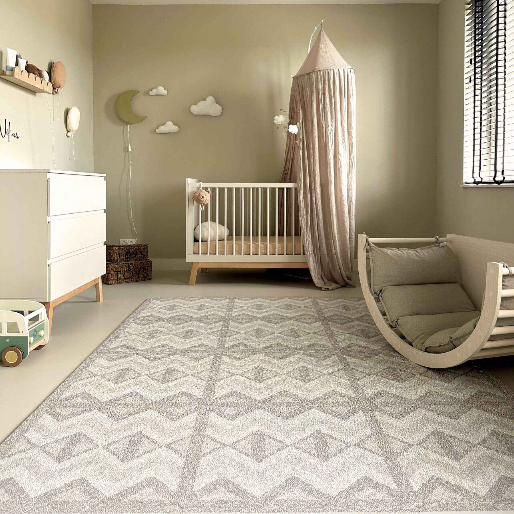 Nursery room with crib, rocking chair, and decorative elements on Eeveve Kilim Play Mat - Dark Taupe