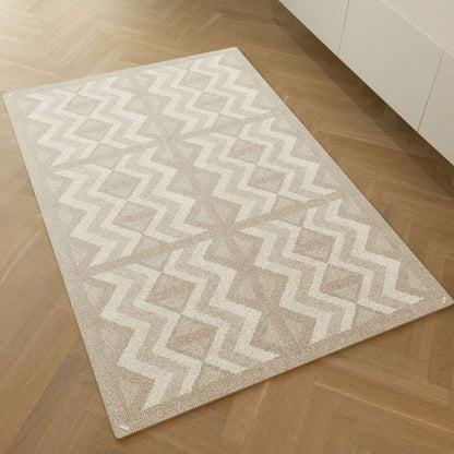 Eeveve Kilim Play Mat - Dark Taupe on a wooden floor