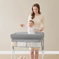 Baby Standing in KUB Foldable Changing Table Grey