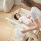 Mom Changing Diaper for Baby on KUB Foldable Changing Table Oat