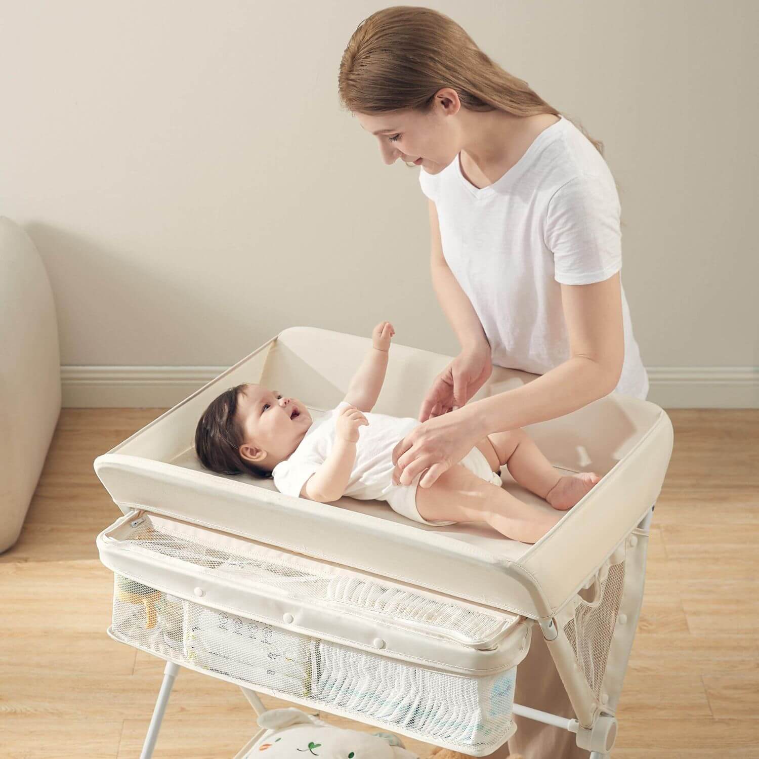 Mom Changing Diaper for Baby on KUB Foldable Changing Table Oat