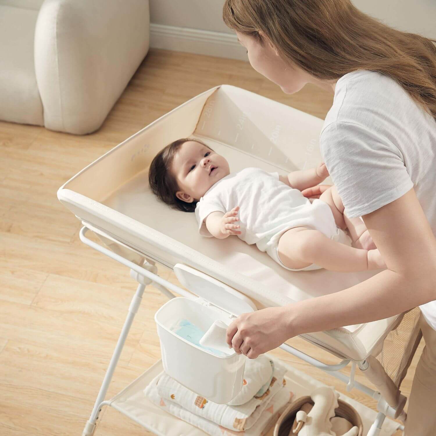 Mom Changing Diaper for Baby on KUB Foldable Changing Table Oat