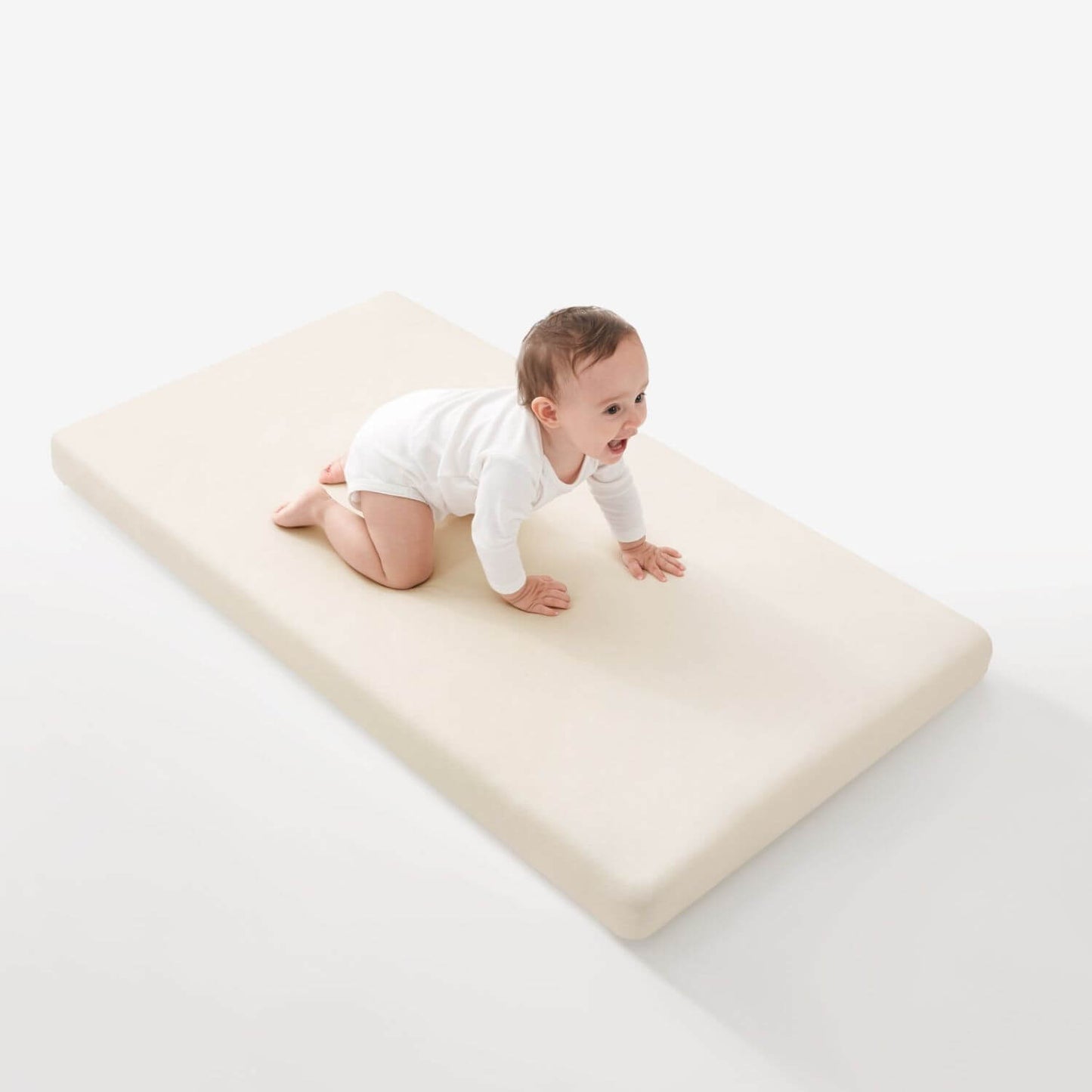 Baby Crawling on KUB Natural Bliss Crib Sheet