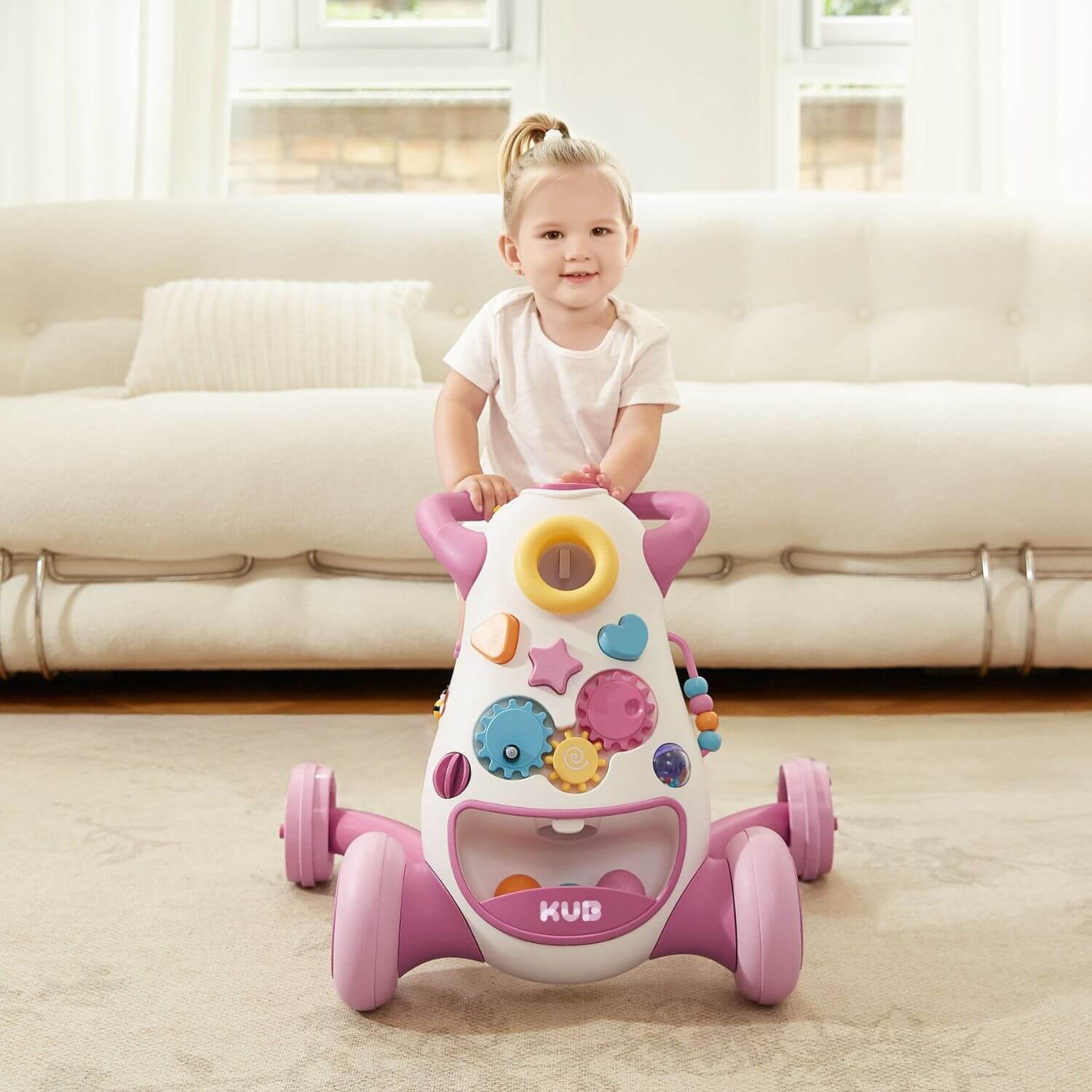 Girl Pushing KUB Baby Push Walker Toy Pink