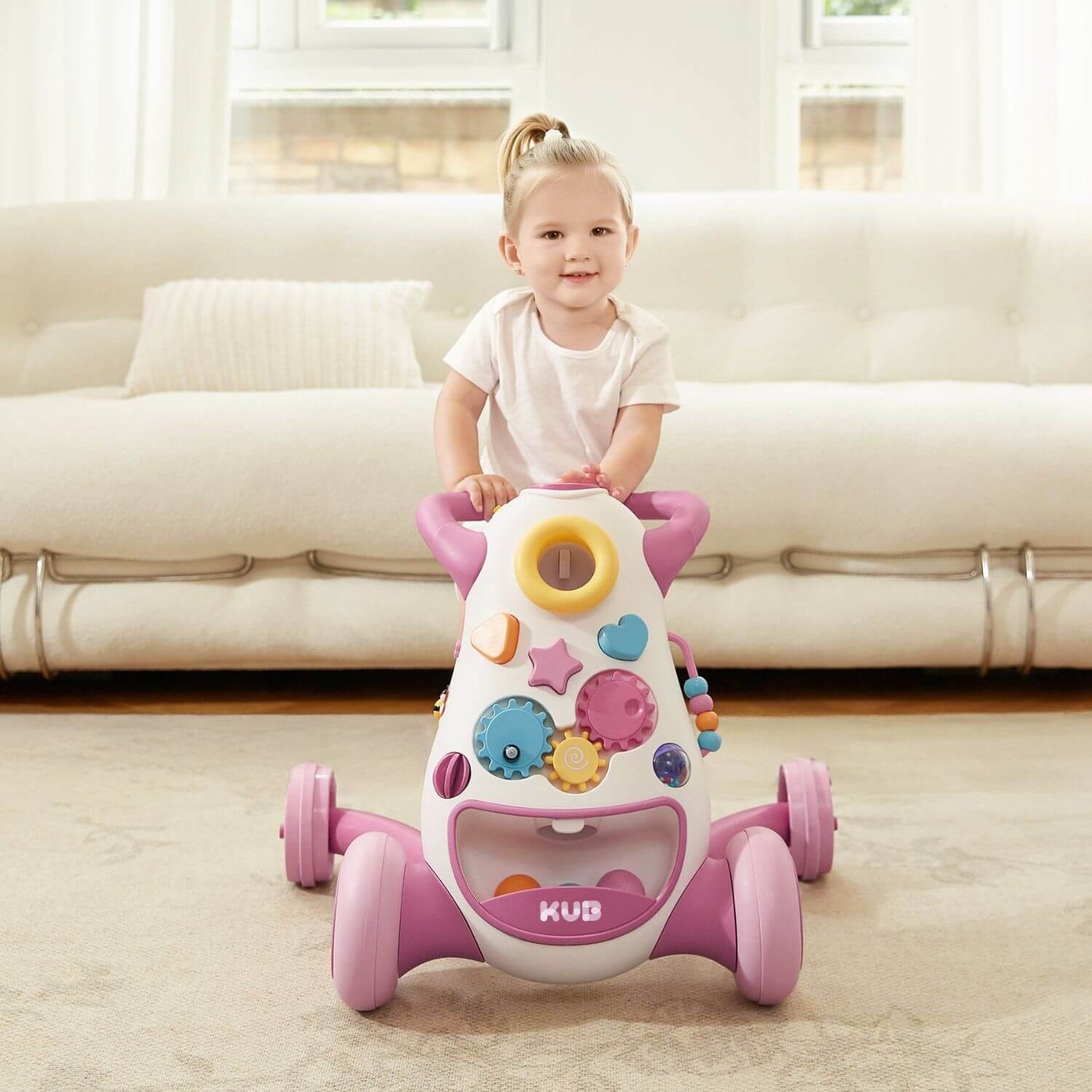 Girl Pushing KUB Baby Push Walker Toy Pink