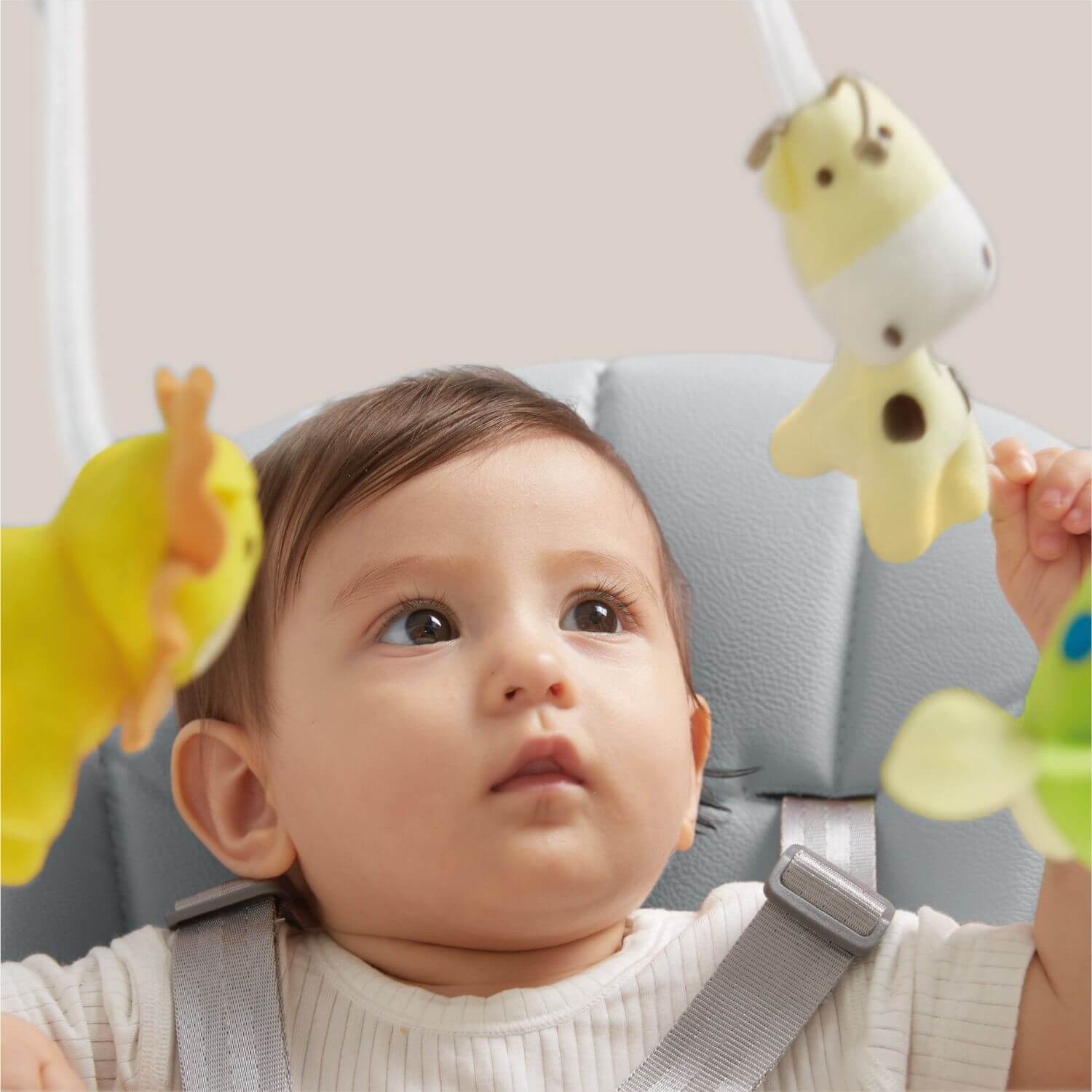 Baby Sitting on KUB Smart Baby Chair Grey, Playing with Toy