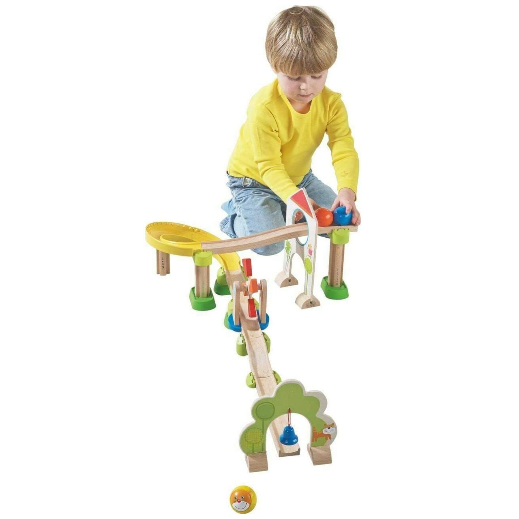 Child playing with HABA USA Kullerbu Windmill 25 Piece Starter Track Set