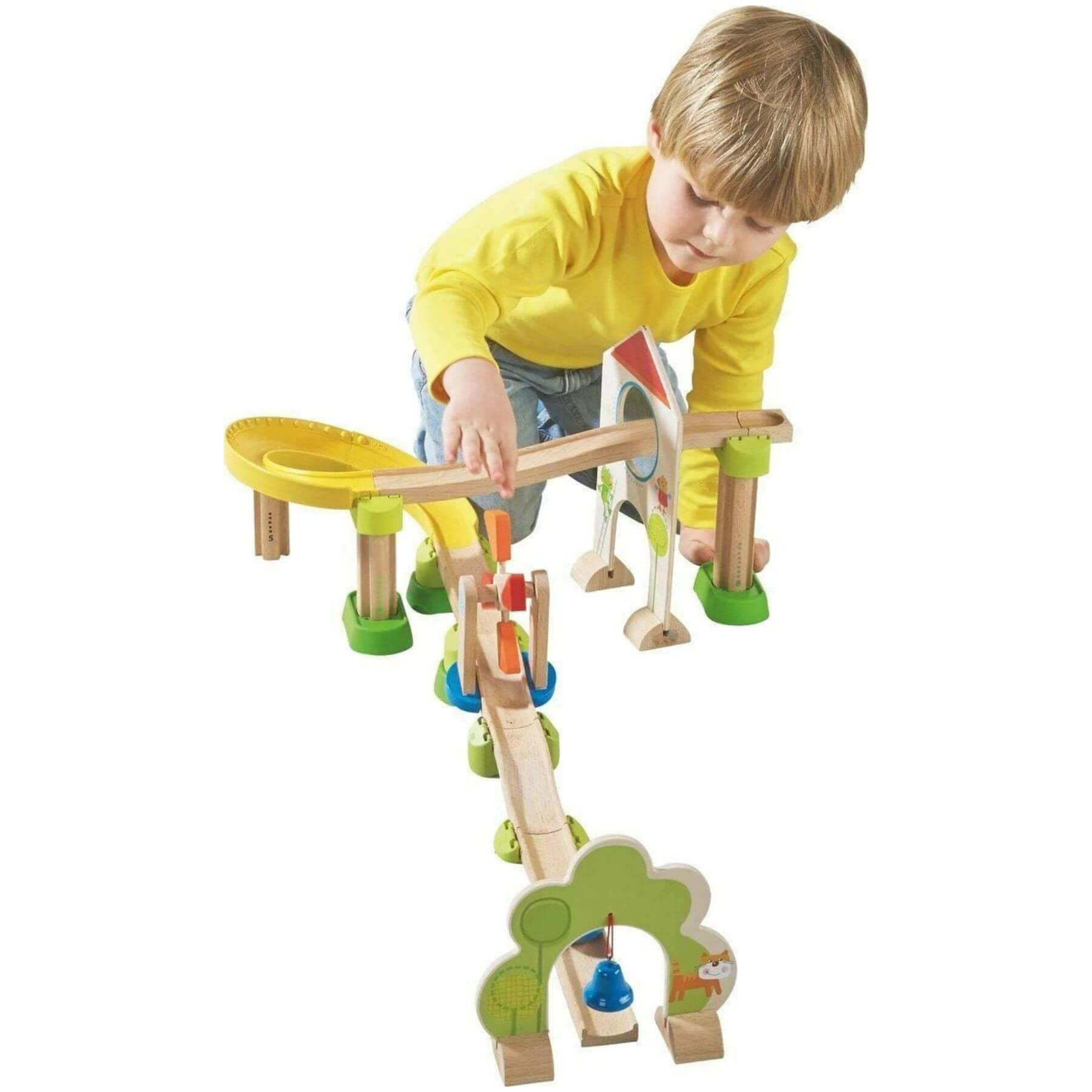 Child playing with HABA USA Kullerbu Windmill 25 Piece Starter Track Set