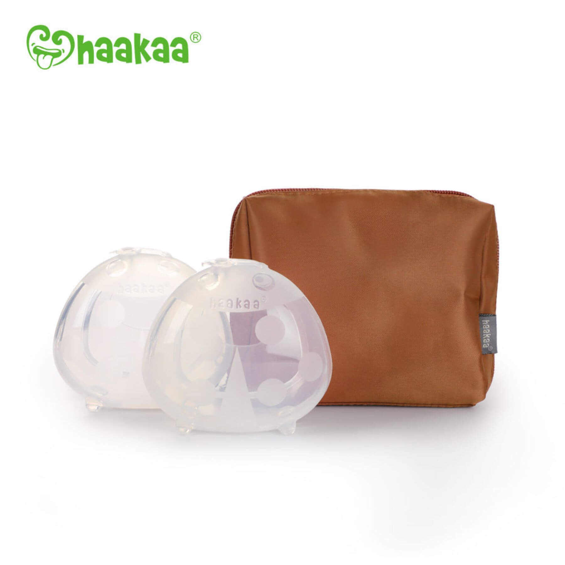 Two silicone breast pads and a brown pouch with 'haakaa' branding on a white background.