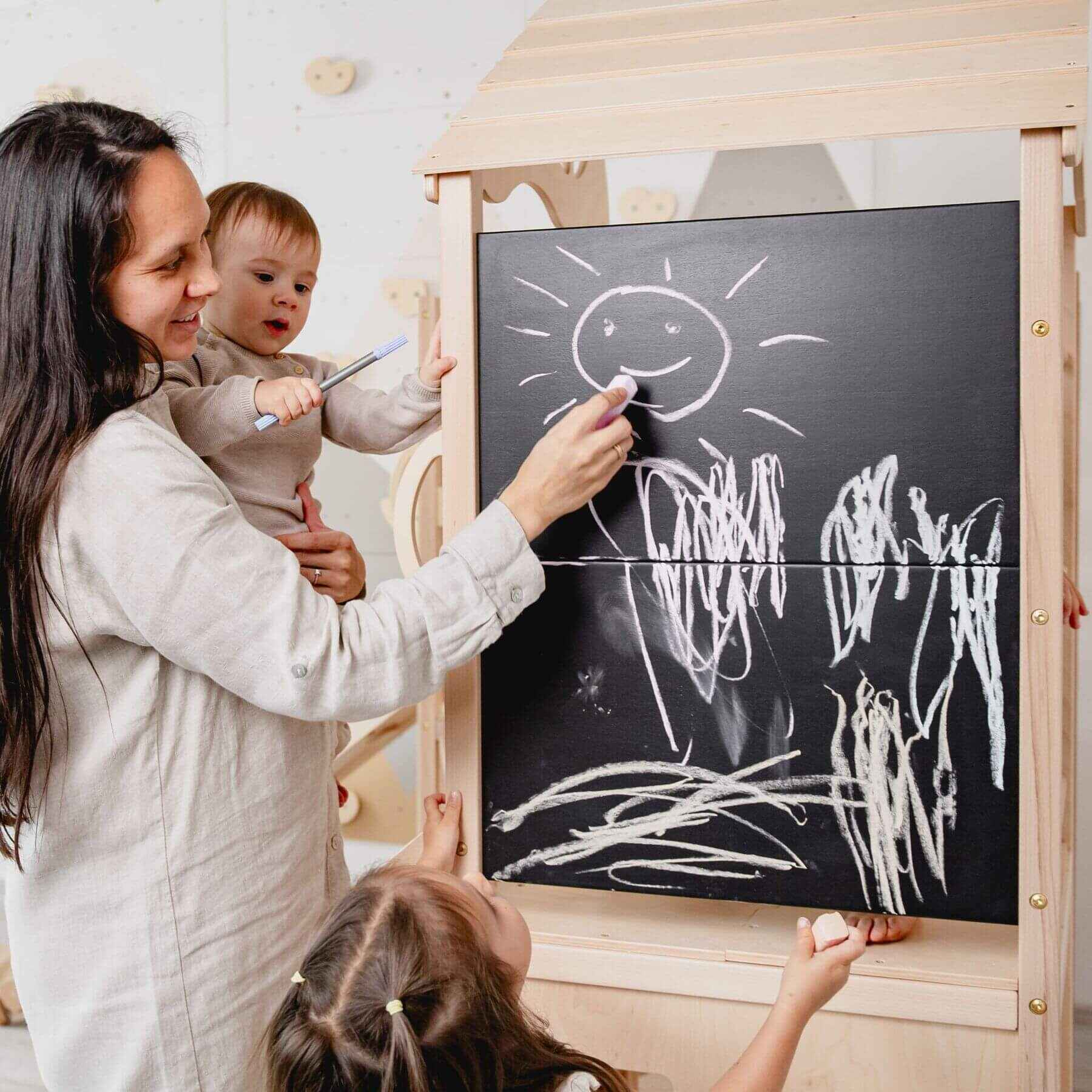 Mom holding kid, drawing on Wood and Hearts Large Playground Climber - Morning Light