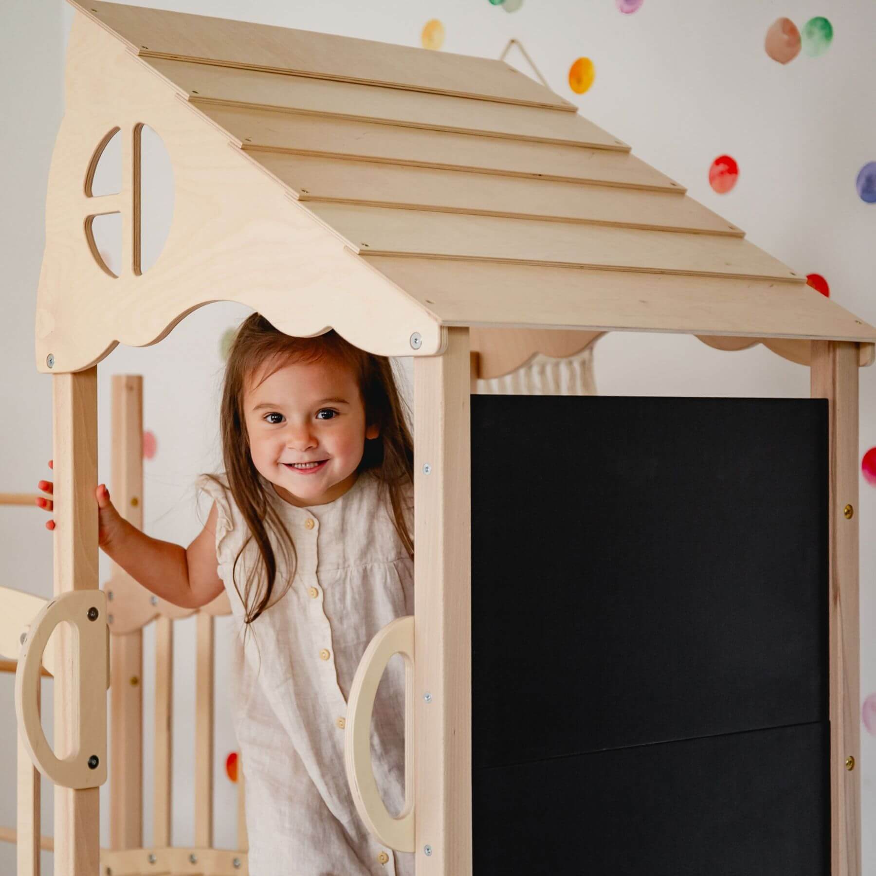 Kid playing on Wood and Hearts Large Playground Climber - Natural