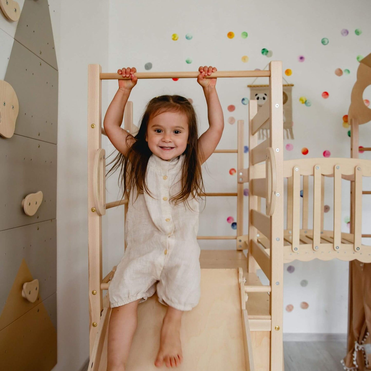 Kid playing on Wood and Hearts Large Playground Climber - Natural