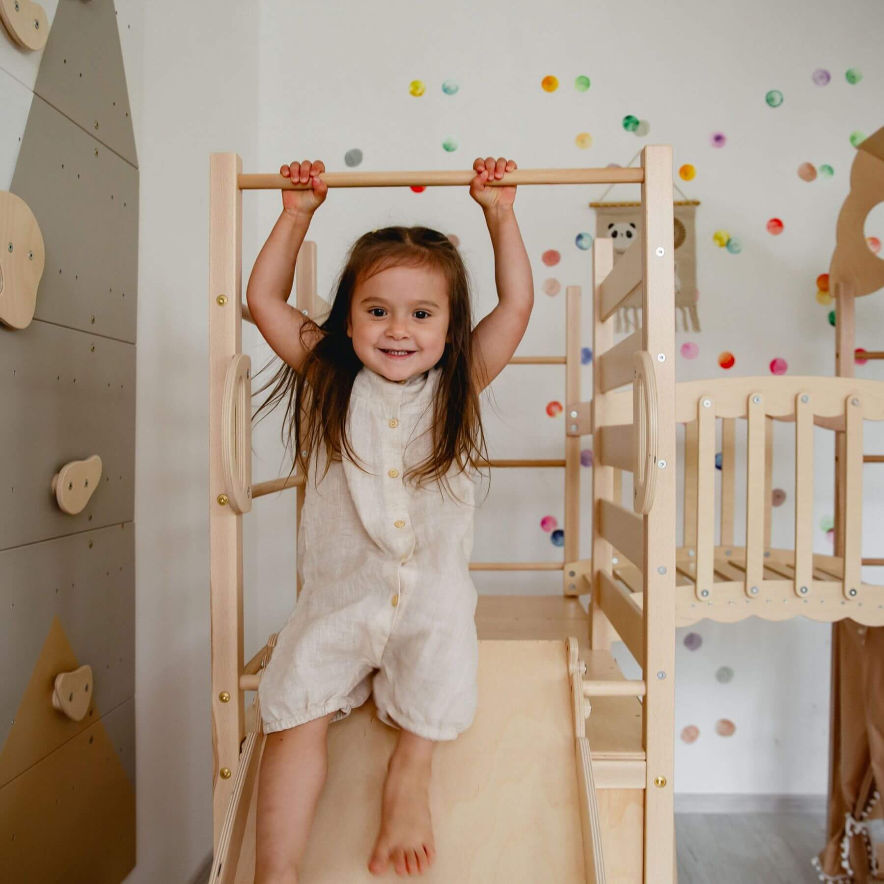 Kid playing on Wood and Hearts Large Playground Climber - Natural