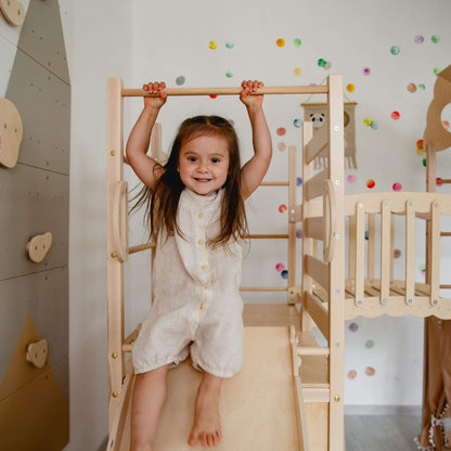 Kid playing on Wood and Hearts Large Playground Climber - Natural