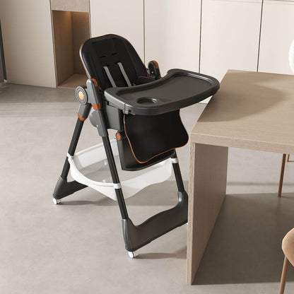Leavader Adjustable Baby High Chair Black next to a wooden table in a modern kitchen setting
