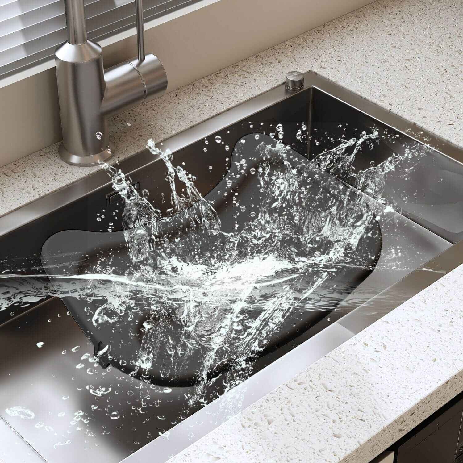 Kitchen sink with water splashing out, showing a close-up of the faucet and sink.