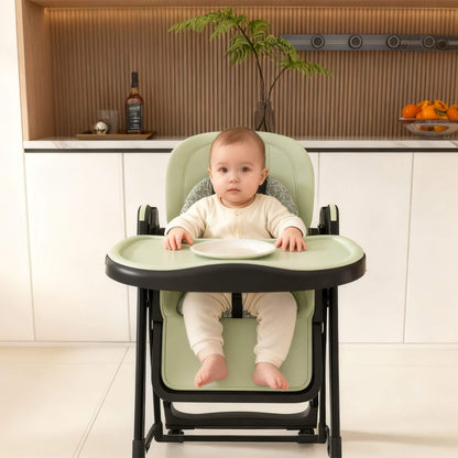 Baby sitting in Leavader Adjustable Baby High Chair - Dark Green in a kitchen setting