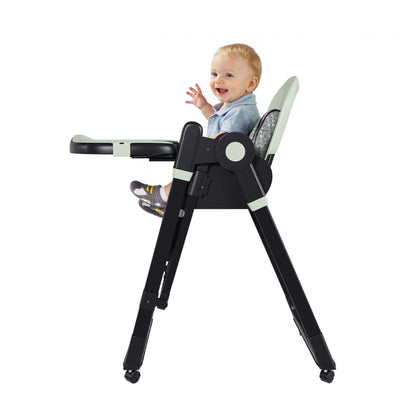 Child sitting in Leavader Adjustable Baby High Chair - Dark Green on a white background