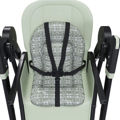 High chair with patterned seat cover and black straps on a white background
