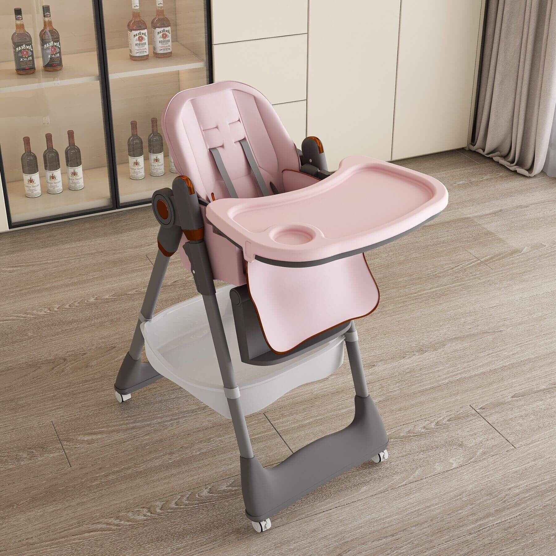 Leavader Adjustable Baby High Chair - Pink on a wooden floor with bottles in the background
